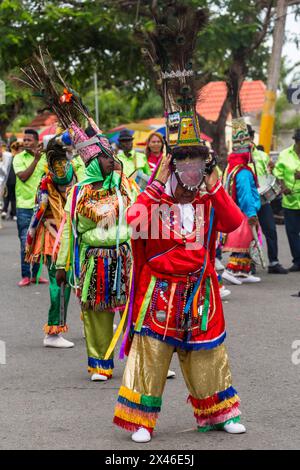 Los Guloyas of San Pedro de Macoris in the La Vega Carnival parade in the Dominican Republic.  They are descendents of slaves brought to the island fr Stock Photo