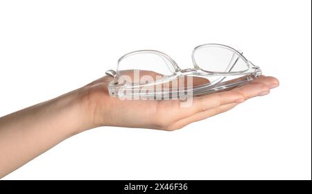 Woman holding glasses with transparent frame on white background, closeup Stock Photo