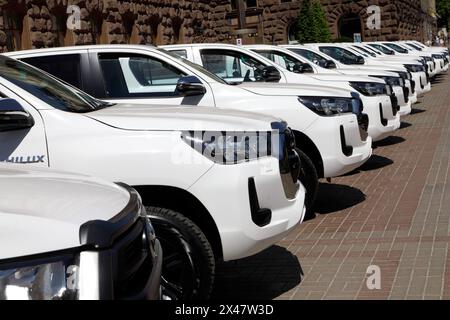 KYIV, UKRAINE - APRIL 30, 2024 - New Toyota Hilux SUVs purchased by the capital for the soldiers of the 3rd Separate Assault Brigade of the Land Forces, outside the Kyiv City State Administration, Kyiv, capital of Ukraine. Stock Photo