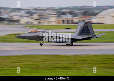 A U.S. F-22A Raptor assigned to the 27th Fighter Squadron arrives at Kadena Air Base, Japan, April 20, 2024. As the 18th Wing continues the phased ret Stock Photo