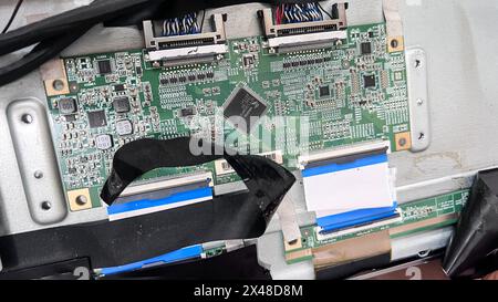 Circuit board with electronic devices attached to the top of the circuit board along There are various IC numbers. Bekasi, Indonesia, May 1, 2024 Stock Photo