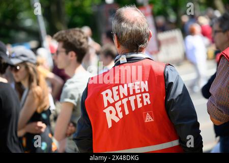 Hanover, Germany. 01st May, 2024. A man wearing a vest with the inscription 'Rentenretter' (pension savers) stands at the main May Day rally of the German Trade Union Confederation (DGB). Credit: Julian Stratenschulte/dpa/Alamy Live News Stock Photo