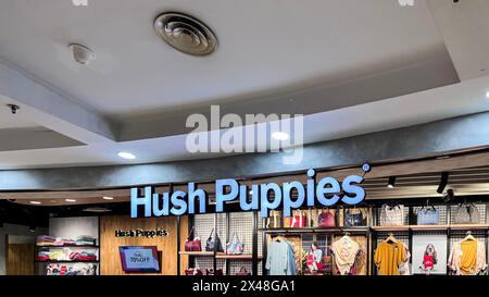 Hush Puppies store, Hush Puppies is an American casual and contemporary shoe brand that is marketed internationally. Bekasi, Indonesia, May 1, 2024 Stock Photo