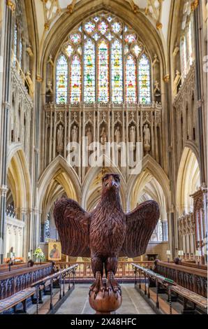 Carved wooden eagle lectern and choir stalls of Wells Cathedral in Somerset UK Stock Photo