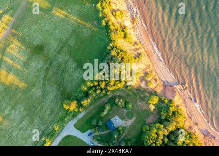 Amazing beach with pink sand near sea. Tropical vegetation with tree. Klungkung Bali Indonesia Stock Photo