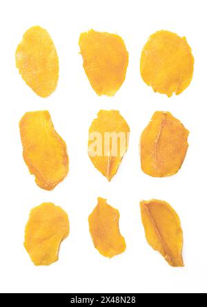 Slices of large sweet dried mangoes isolated on white.Top view Stock Photo