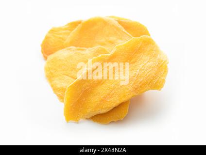 Slices of large sweet dried mangoes on white background. Stock Photo