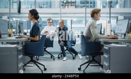 Diverse Team of Managers Working and Having Discussions in Modern Big City Office. Colleagues Work on New Business Opportunities, Evaluate Financial Reports, Plan Investment Strategy. Stock Photo