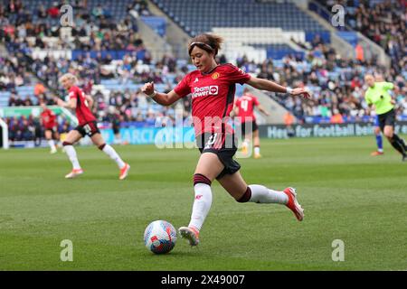 Hinata Miyazawa of Manchester United runs with the ball during the Barclays WomenÕs Super League match between Leicester City and Manchester United. Stock Photo