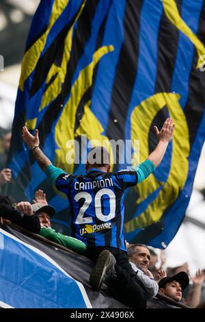 Milan, Italy. 28 April 2024. A fan of FC Internazionale wears a shirt bearing the write 'Campioni 20' (Champions 20) during the Serie A football match between FC Internazionale and Torino FC. Credit: Nicolò Campo/Alamy Live News Stock Photo