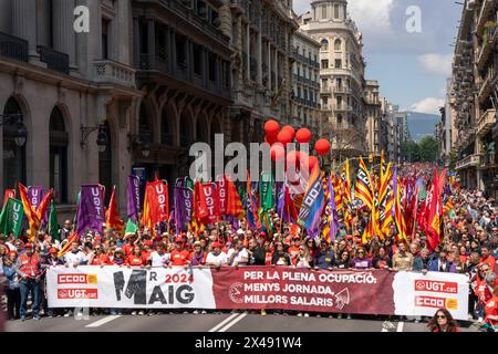 Barcelona, Spain. 01st May, 2024. May 1st demonstration, Workers' Day, organized by the main unions, CCOO and UGT, where about 10,000 people gathered, demanding a reduction in the workday and salary improvement. Manifestación del 1 de mayo, D&#xed;a del Trabajador, organizada por los principales sindicatos, CCOO y UGT, donde se reunieron unas 10.000 personas, exigiendo la reducción de la jornada laboral y mejoras salariales. in the pic: News politics -Barcelona, Spain wednesday, may 1, 2024 (Photo by Eric Renom/LaPresse) Credit: LaPresse/Alamy Live News Stock Photo