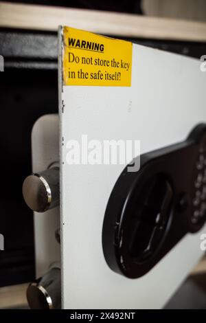 Closeup of hotel safe deposit box remain open in hotel guest room Stock Photo