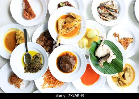 Top View Nasi Padang, various Minang Side Dish on the Table Stock Photo