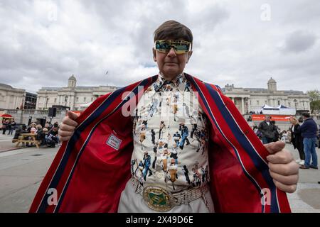 Man dressed in 1960's attire attends The Feast of St. George Festival in Trafalgar Square, April 23rd 2024 Stock Photo