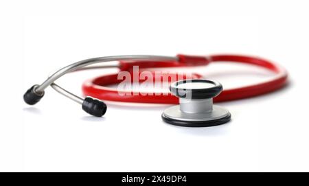 Red stethoscope with black silver head isolated on whote background. Medical education object concept Stock Photo