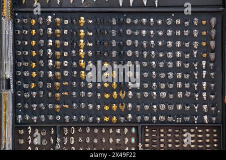 A selection of punk style rings on display at Camden market in London Stock Photo