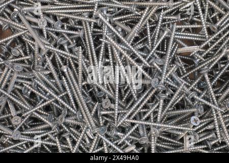 A pile of self-tapping screws. Full frame Stock Photo