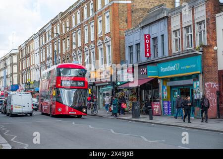 LONDON- APRIL 2nd, 2024: Kilburn High Road in NW6 North West London. A long and busy a high street of shops Stock Photo