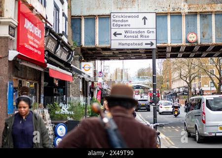 LONDON- APRIL 4th, 2024:  Kilburn High Road in NW6 North West London. A long and busy a high street of shops Stock Photo