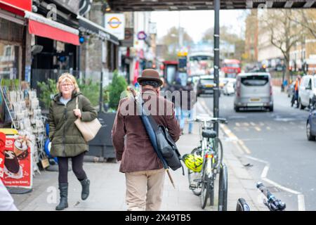 LONDON- APRIL 4th, 2024:  Kilburn High Road in NW6 North West London. A long and busy a high street of shops Stock Photo