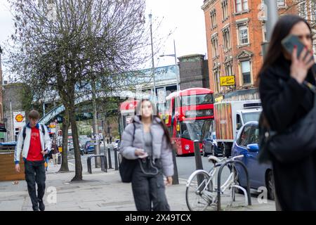 LONDON- APRIL 4th, 2024:  Kilburn High Road in NW6 North West London. A long and busy a high street of shops Stock Photo