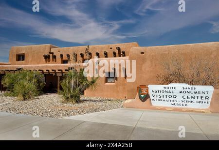 The White Sands National Monument Visitor Center entrance with signage and adobe pueblo style building in Alamogordo, New Mexico, USA Stock Photo