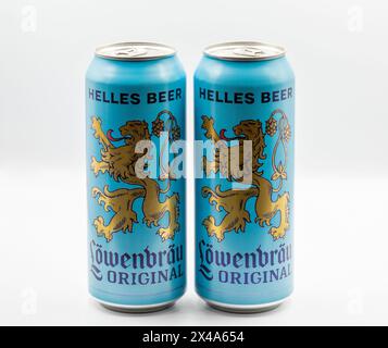 Kyiv, Ukraine - April 01, 2023: Studio shoot of Wolters Pils German beer cans cans closeup on white. Lowenbrau is a brewery founded in Munich around 1 Stock Photo