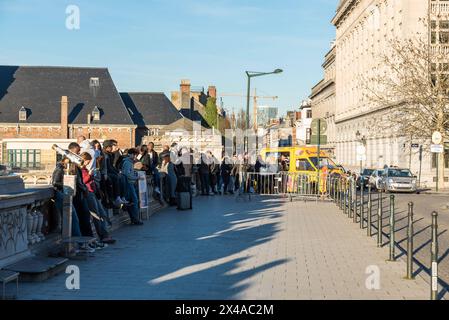 City of Brussels - Belgium - 02 15 2019 - Young friends together, waitng for the ice cream truck at the Poelaert square Stock Photo