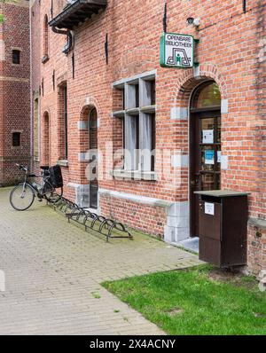 Bissegem, West Flanders Region - Belgium - 07 18 2021 Public library of the village with bike stand Stock Photo