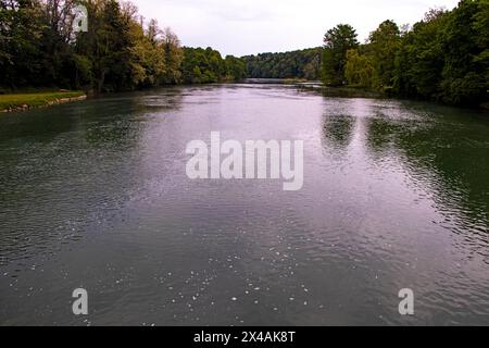 River of Krka near castle of Otocec wtih clean river water and green vegetation on both banks Stock Photo