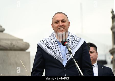 TRAFALGAR SQUARE, LONDON, UK. 1st May, 2024. Speaker Dr. Husam Zomlot is a Palestinian Ambassador in the UK. He is speaking at the rally against genocide in Gaza, Palestine. The UK government must stop selling arms to Israel. Credit: See Li/Picture Capital/Alamy Live News Stock Photo