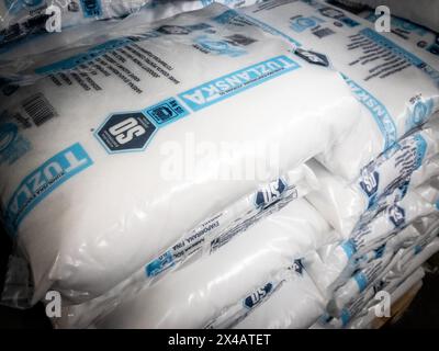 Picture of bags of salt packed and stacked in a warehouse of belgrade. It was produced by Solana tuzla, and it's a major salt production in balkans. Stock Photo