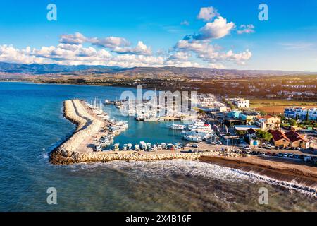 View of Latchi port, Akamas peninsula, Polis Chrysochous, Paphos, Cyprus. The Latsi harbour with boats and yachts, fish restaurant, promenade, beach t Stock Photo