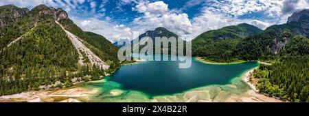 View to Julian Alps mountains above Predil lake in Italy with small lake. Predil Lake, Friuli Italy / (Lago del Predil), beautiful alpine lake in nort Stock Photo