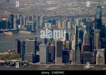 Aerial view of southern tip of Manhattan with Jersey City in the background on the other side of Hudson River, April 2024 Stock Photo