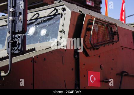 Bullet holes are seen on the windshield of a Turkey-made military vehicle displayed at the exhibition of trophy military equipment in Moscow. An exhibition of trophy military equipment captured by Russian servicemen during the Russian-Ukraine war, known as the special military operation in Russia, opened in the Victory Park in Moscow on May 1, 2024. Damaged, destroyed, and captured military equipment of NATO countries and Ukraine are exhibited to the Russian public. The Russian-Ukraine war began on February 24, 2024. Since then the NATO countries have been supplying the Ukraine army with weapo Stock Photo