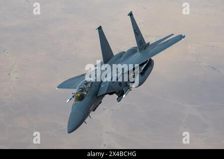 A U.S. Air Force F-15E Strike Eagle from Seymour-Johnson Air Force BaseÕs 335th Fighter Squadron breaks off after receiving fuel from a KC-135 Stratot Stock Photo