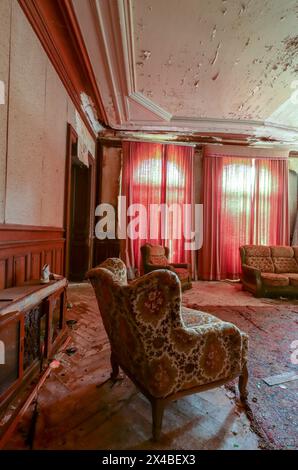 vintage armchair with old charm in an abandoned lost place house Stock ...