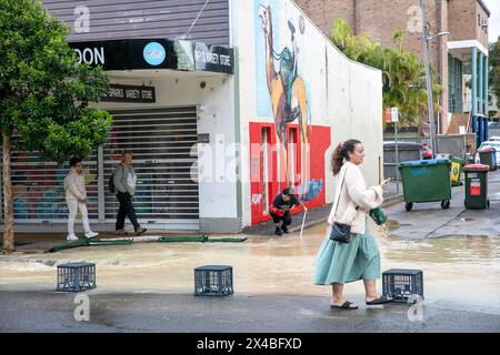 Thursday 2nd May 2024, Following heavy rains across Sydney and New South Wales, the Sydney village of Avalon Beach was partially flooded following a water pipe blockage, Sydney Water utility company attended the scene whilst residents either closed their shops or used sand bags to divert the water away, Sydney,NSW,Australia. Credit Martin Berry @ alamy live news. Stock Photo