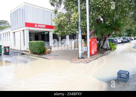 Thursday 2nd May 2024, Following heavy rains across Sydney and New South Wales, the Sydney village of Avalon Beach was partially flooded following a water pipe blockage, Sydney Water utility company attended the scene whilst residents either closed their shops or used sand bags to divert the water away, Sydney,NSW,Australia. Credit Martin Berry @ alamy live news. Stock Photo