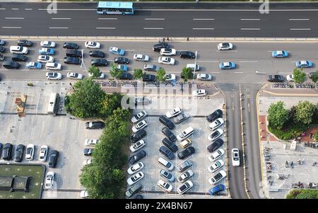 Aerial View of Busy Urban Parking Lot During Daytime Rush Hour /Dongying China Stock Photo
