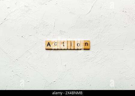 Action word written on wood block. Action text on table, concept. Stock Photo