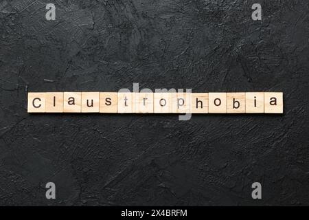 claustrophobia word written on wood block. claustrophobia text on table, concept. Stock Photo