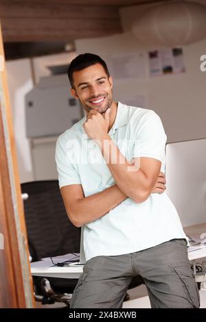 Computer engineer, thinking and idea by desk in office with confidence for startup business, software and tech company. Man, planning and happy by Stock Photo