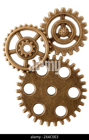 Group of aged bronze cogwheels, arranged as part of antique mechanism, isolated on white background. Ready to use design element. Stock Photo