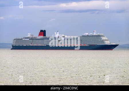 Maiden UK arrival of Queen Anne, a Pinnacle class cruise ship operated by Cunard Line, part of the Carnival Corporation 30 April 2024. Stock Photo