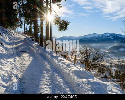 Snowy track above the valley of river Iller. The Allgau Alps near Oberstdorf during winter in Bavaria, Germany. Stock Photo