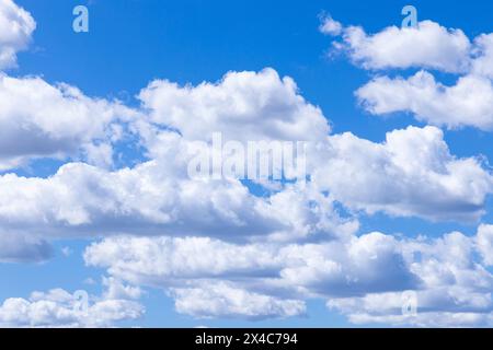 Portugal, Evora. White clouds floating in a blue sky. Stock Photo