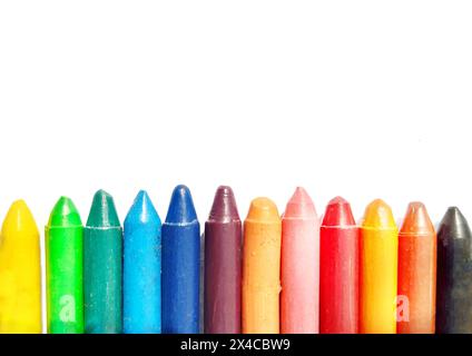Multicolour crayon isolated in white background. Crayons. Colourful wax pencils collection. Seven colours of crayon. Used crayon pencils. Pile of crayon isolated in white background. Stock Photo