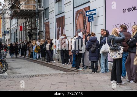 Copenhagen, Denmark - April 5, 2024: Young people queueing up on a street for Globe Studios pop up store. Stock Photo